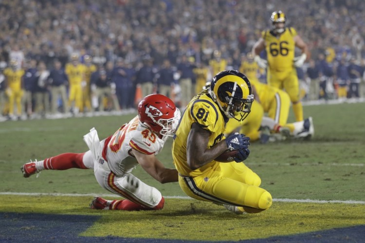 Los Angeles Rams tight end Gerald Everett scores a touchdown after catching a pass ahead of Kansas City Chiefs defensive back Daniel Sorensen, left, during the second half of the Rams' 54-51 win on Monday night in Los Angeles.