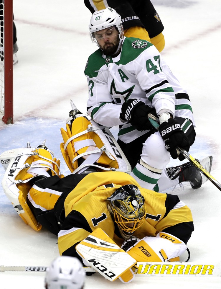 Penguins goalie Casey DeSmith covers a rebound before Alexander Radulov of the Stars can reach it in Wednesday night's game at Pittsburgh. The Penguins cruised to a 5-1 win.