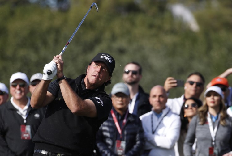Phil Mickelson hits off the second fairway during his match against Tiger Woods at Shadow Creek on Friday in Las Vegas. Mickelson won the match on the fourth playoff hole.