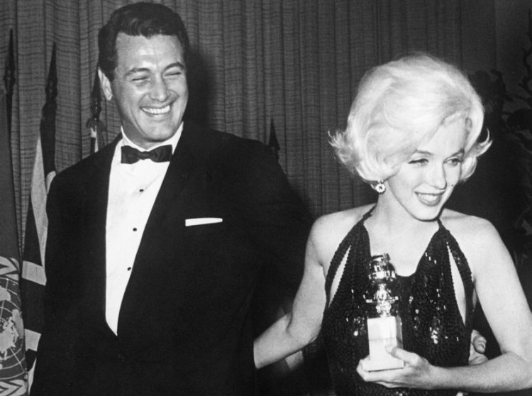 Rock Hudson and Marilyn Monroe attend the Golden Globes in 1962.