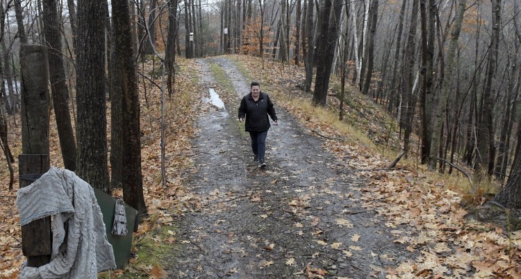 Monique Poulin walks to her home down the road from the Augusta Public Works facility. Her only alternative route is a challenging flight of 100 steps.