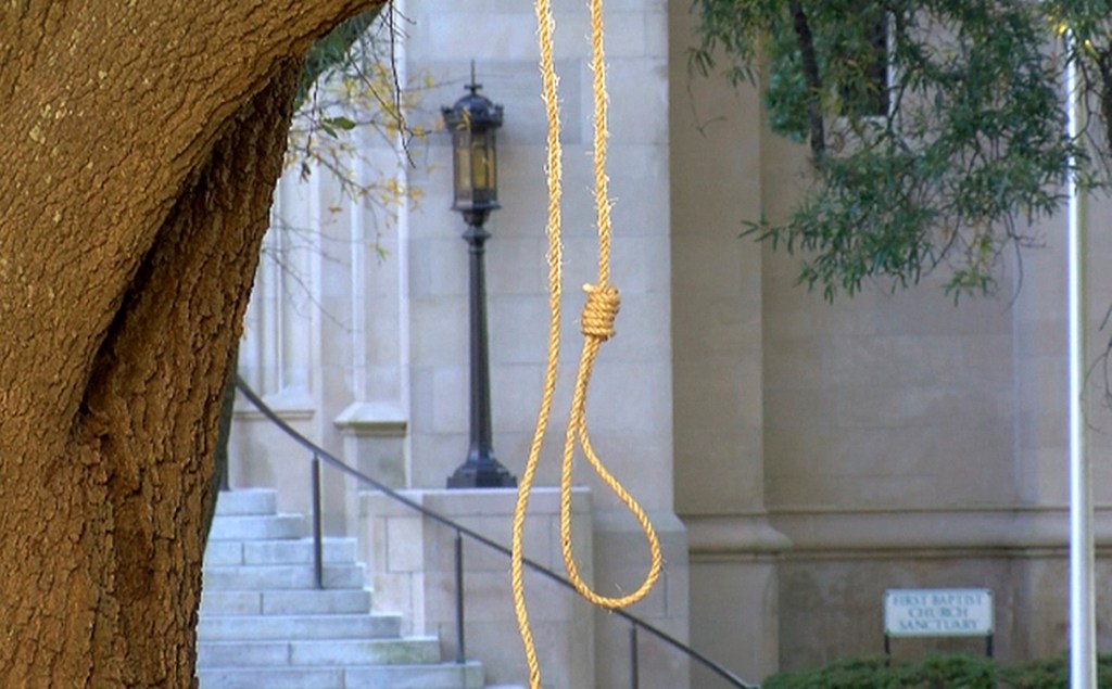 A noose hangs on a tree on the state capitol grounds in Jackson, Miss., on Monday. One sign that accompanied a noose read "We're hanging nooses to remind people that times haven't changed."