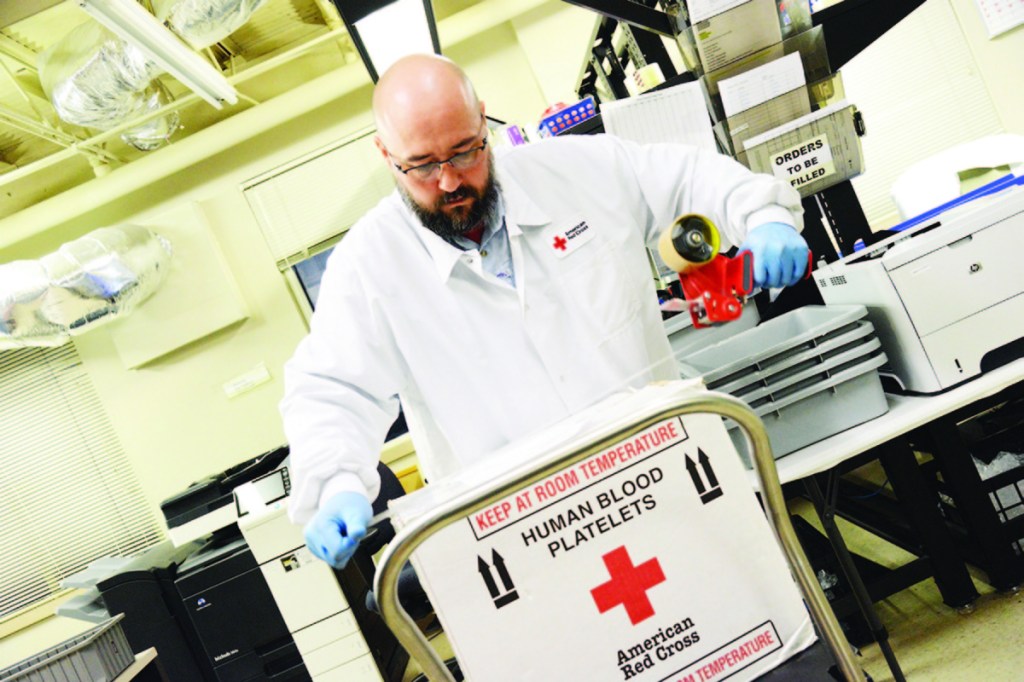 Red Cross employee Bob Otwell prepares blood products for distribution to nearby hospitals in 2017 in Houston, Texas.