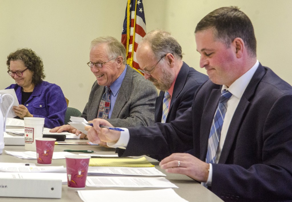 Ethics commission members, from left, Meri N. Lowry, Richard A. Nass, William A. Lee III and Bradford A. Pattershall hear former Waterville City Council candidate Catherine Weeks' complaint about an anonymous campaign flier. Lee recused himself because he is also the city attorney for Waterville.