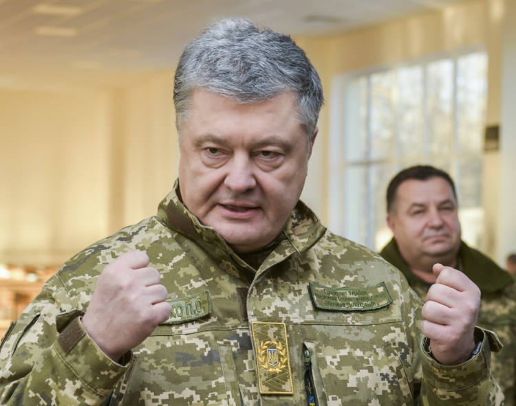 Ukrainian President Petro Poroshenko has ordered martial law over an incident for which he and Vladimir Putin trade blame.