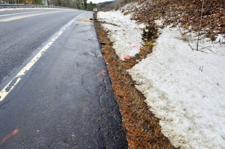 Orange paint marks an accident scene Thursday on Route 3 east of Lake St. George State Park in Liberty. Three people died on the road in two days.