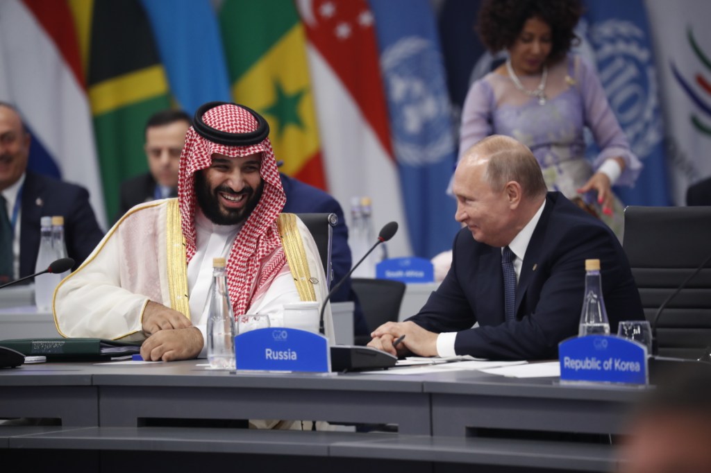 Saudi Arabia Crown Prince Mohammed bin Salman talks with Russia President Vladimir Putin during a G20 session with other heads of state, Friday, Nov. 30, 2018 in Buenos Aires, Argentina. (AP Photo/Pablo Martinez Monsivais)