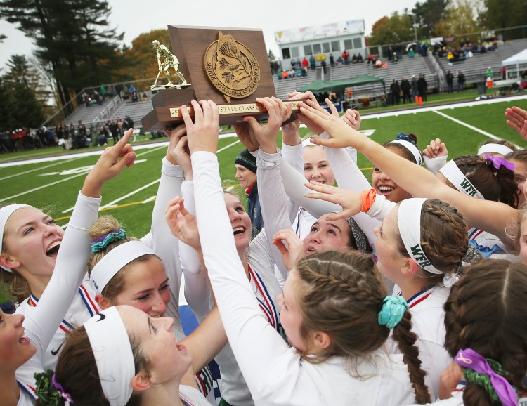 Winthrop celebrates after beating Spruce Mountain 3-1 in the Class C field hockey state championship game on Saturday at Deering High School.