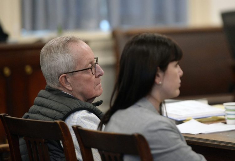 Ronald Paquin listens to his attorney Roger Champagne give his closing argument Wednesday in York County Superior Court. Sitting to his right is Paquin's attorney Valerie Randall. Paquin is charged with sexually abusing two boys on trips to Maine in the 1980s.