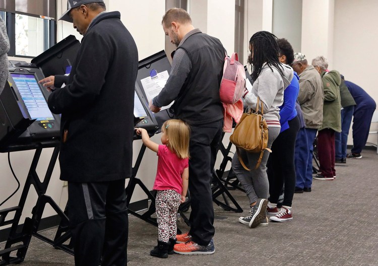 Residents cast early ballots Monday at the St. Louis County Board of Elections in St. Ann, Mo. Missouri is among the states that have had problems with their voting systems this fall.