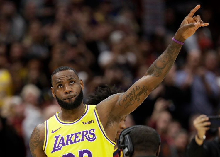 Los Angeles Lakers' LeBron James acknowledges the Cleveland fans during a video tribute to James during the first half of an NBA basketball game between the Lakers and the Cleveland Cavaliers, Wednesday, Nov. 21, 2018, in Cleveland.