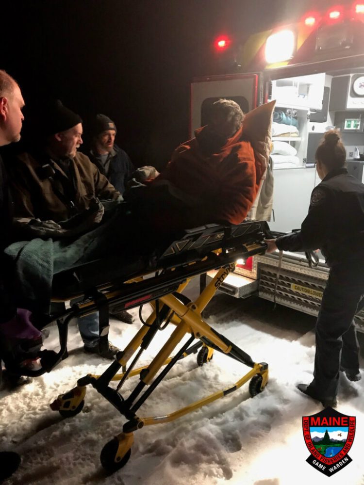 Donald Merrill is loaded into an ambulance after being rescued by game wardens on Westport Island on Nov. 19. 