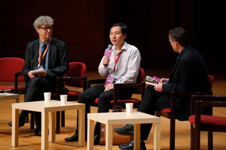 He Jiankui, a Chinese researcher, center, speaks during the Human Genome Editing Conference in Hong Kong on Wednesday.