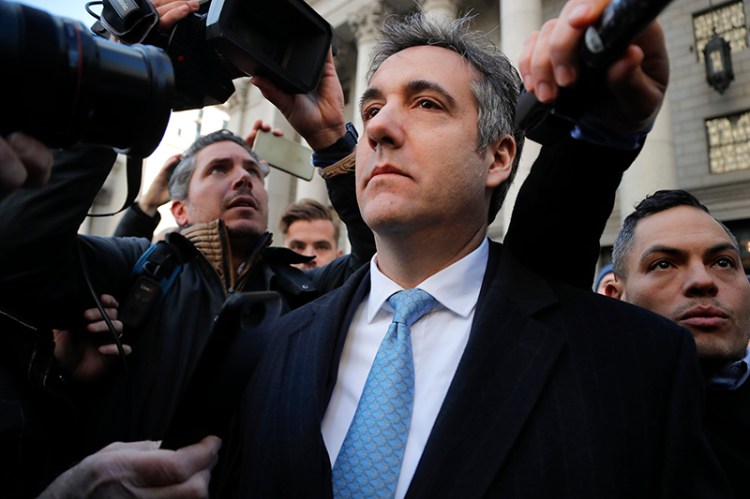 Michael Cohen walks out of federal court, Thursday, Nov. 29, 2018, in New York. Cohen, President Donald Trump's former lawyer,  pleaded guilty to lying to Congress about work he did on an aborted project to build a Trump Tower in Russia. He told the judge he lied about the timing of the negotiations and other details to be consistent with Trump's "political message." 
