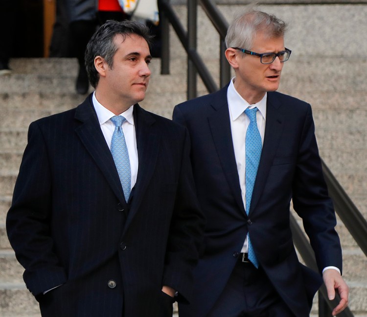 Michael Cohen, left, walks out of federal court with his attorney Guy Petrillo on Thursday morning in New York.
