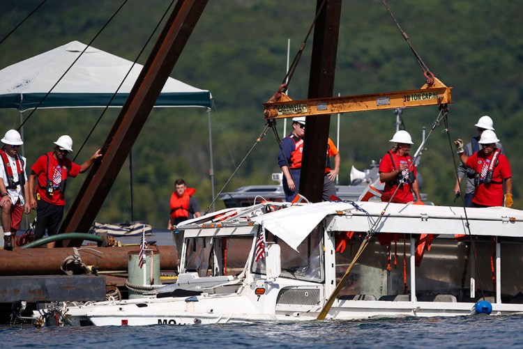 A duck boat that sank in Table Rock Lake in Branson, Mo., is raised after it went down the evening of July 19 after a thunderstorm generated near-hurricane strength winds, killing 17 people. 