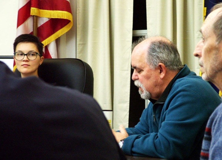 Belfast Mayor Samantha Paradis, left, and City Councilor Mike Hurley, second from right, during a meeting last month about an opinion column by Paradis that appeared in The Republican Journal.