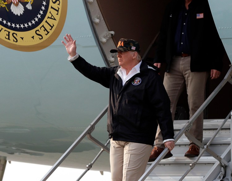 President Trump  arrives on Air Force One at Beale Air Force Base for a visit to areas impacted by the wildfires in California. He is followed by House Majority Leader Kevin McCarthy of Calif.  