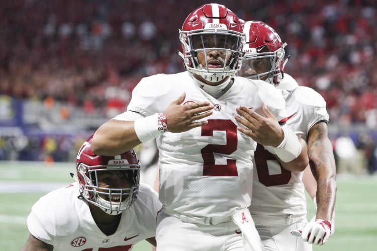 Alabama quarterback Jalen Hurts (2) celebrates after scoring the during the fourth quarter against Georgia during the SEC Championship Game on Saturday in Atlanta.