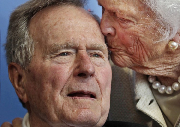 George and Barbara Bush, shown in 2012, will be missed in Kennebunkport, a neighbor writes.
