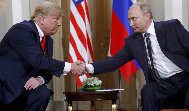 President Trump and Russian President Vladimir Putin shake hands at the beginning of a meeting in Helsinki, Finland, on July 16, 2018.