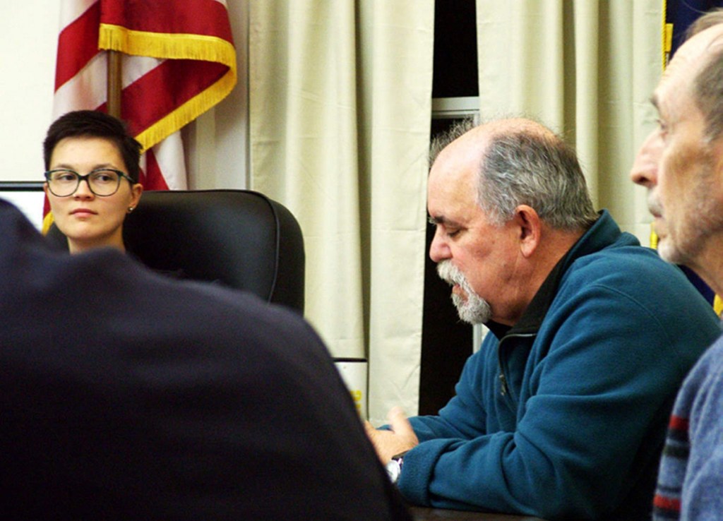 Belfast Mayor Samantha Paradis glances at City Councilor Mike Hurley, second from right, as elected officials met Tuesday to try to patch up differences.