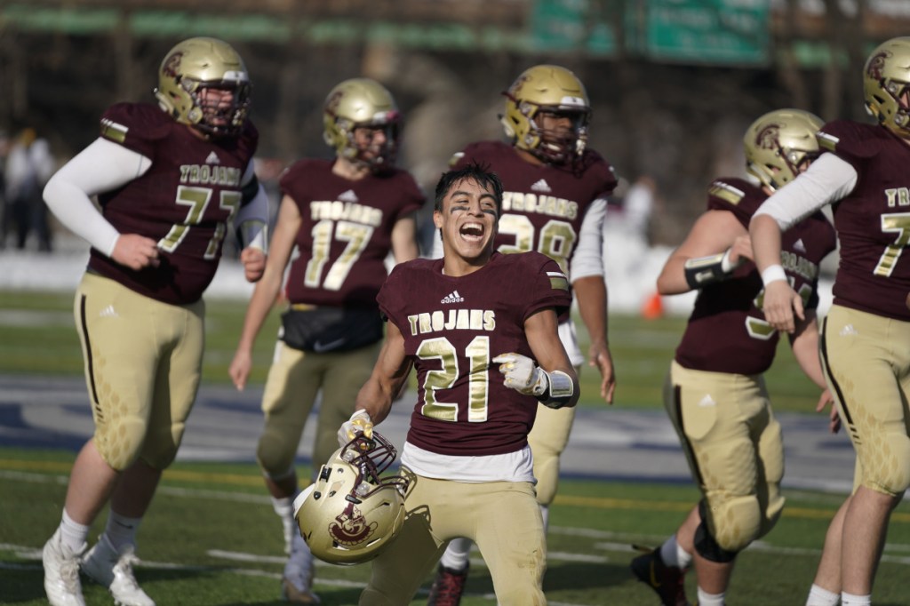 Anthony Bracamonte of Thornton Academy celebrates after the Trojans' victory over Portland in the Class A football state championship at Portland's Fitzpatrick Stadium on Nov. 17. (Staff photo by Gregory Rec/Staff Photographer)