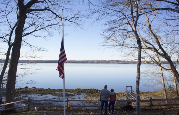 Mark and Glenda Wyman look out from their property in Brunswick at the subtidal waters of Maquoit Bay, where a proposed oyster farm would be located. "I don't have any problem with aquaculture," says Mark Wyman, who worries about deer crossings as well as about discord in Mere Point. "I just don't think this is a good place for it."