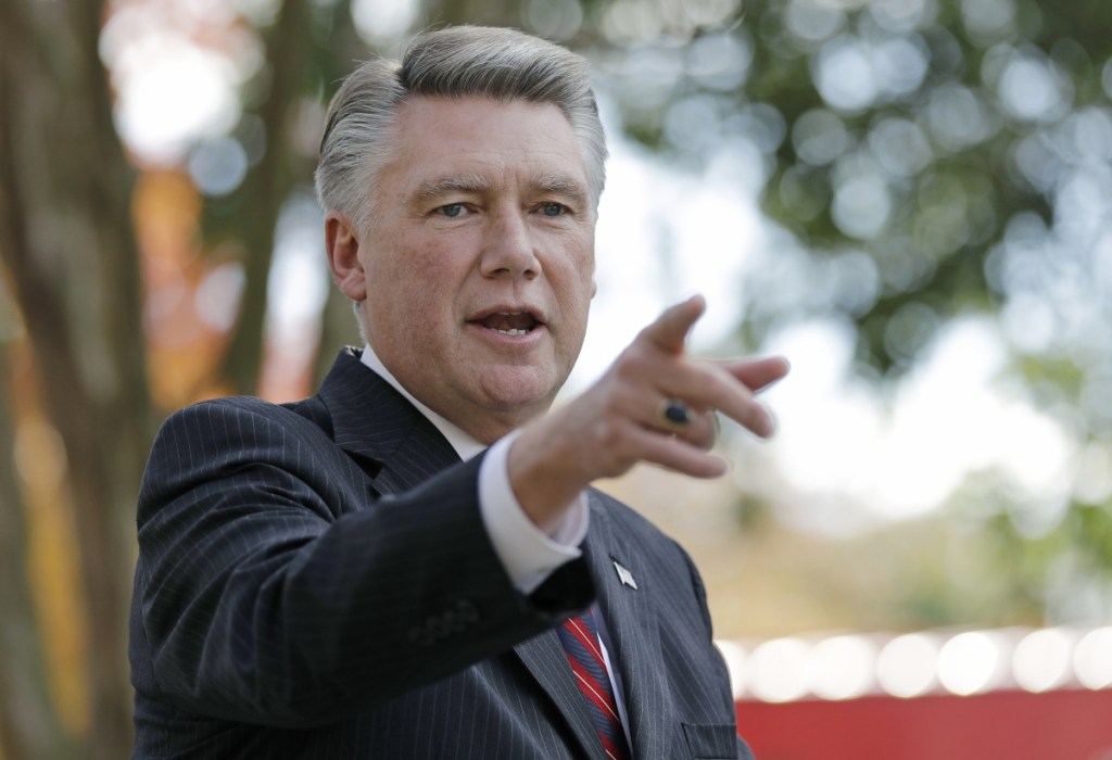 Republican Mark Harris defeated a three-term incumbent in the primary and leads Democrat Dan McCready by 905 votes in Bladen County, N.C. The nation's last unresolved congressional race is in doubt amid voter fraud probes.