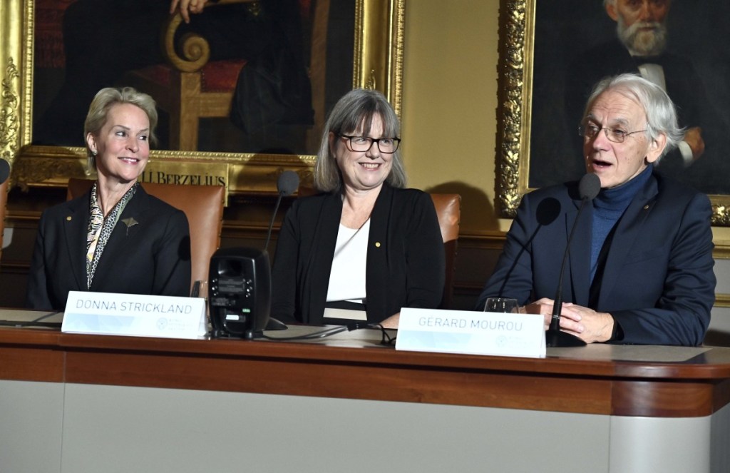 Frances H. Arnold, 2018 Nobel laureate in Chemistry, left, Professor Donna Strickland, 2018 Nobel laureate in Physics, and Professor Gerard Mourou, 2018 Nobel laureate in Physics take part in a press conference at the Royal Academy of Science in Stockholm, Sweden, Friday Dec. 7, 2018.