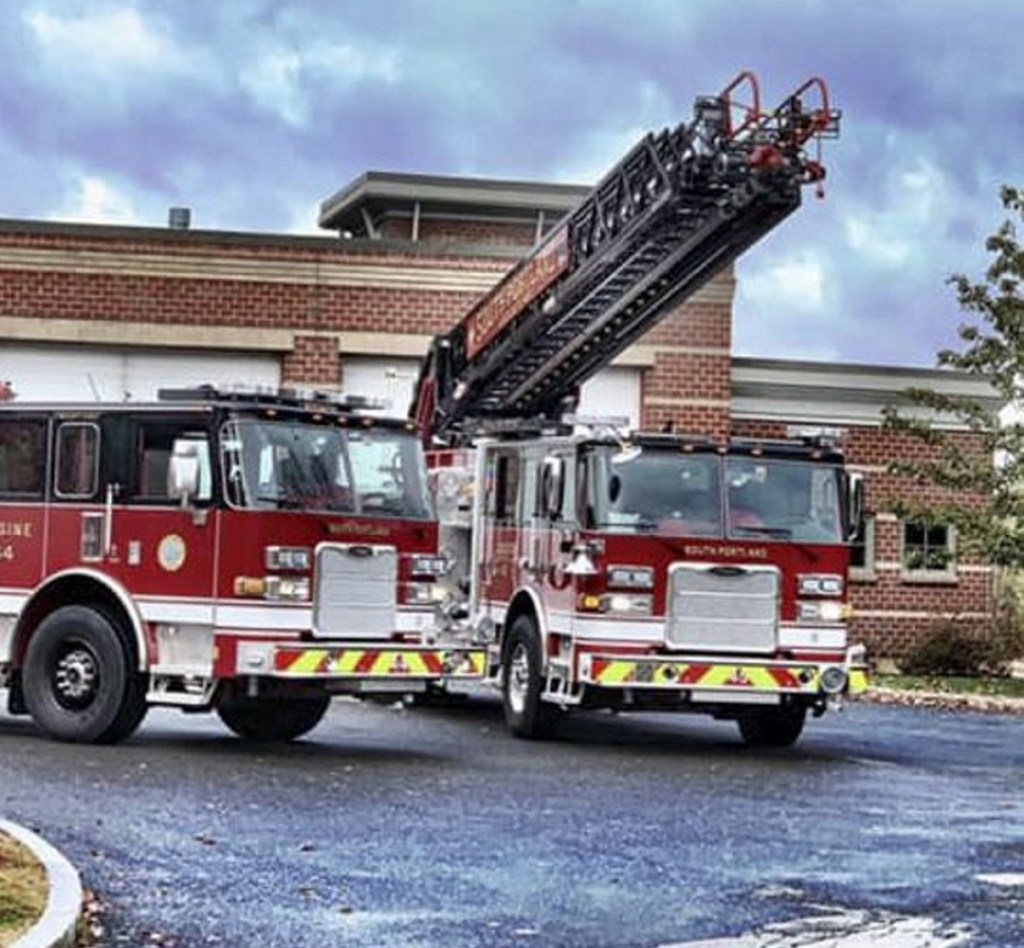 The South Portland Fire Department's new ladder truck, right, has been out of service since the October incident and officials have yet to determine whether the million-dollar truck is a total loss.