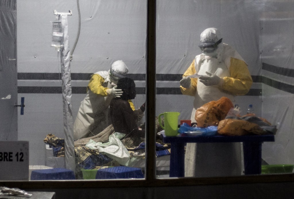 Health workers treat a patient an Ebola treatment center in Butembo, Congo, on Nov. 3. Dr. Peter Salama, the World Health Organization's emergencies director, says the agency is very concerned about the size of the vaccine stockpile.