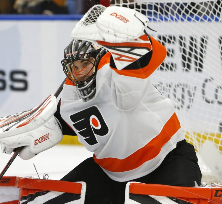 Philadelphia goalie Anthony Stolarz makes a glove save in the first period of the Flyers' 6-2 win over Buffalo on Saturday in Buffalo, N.Y. Stolarz made 28 saves.