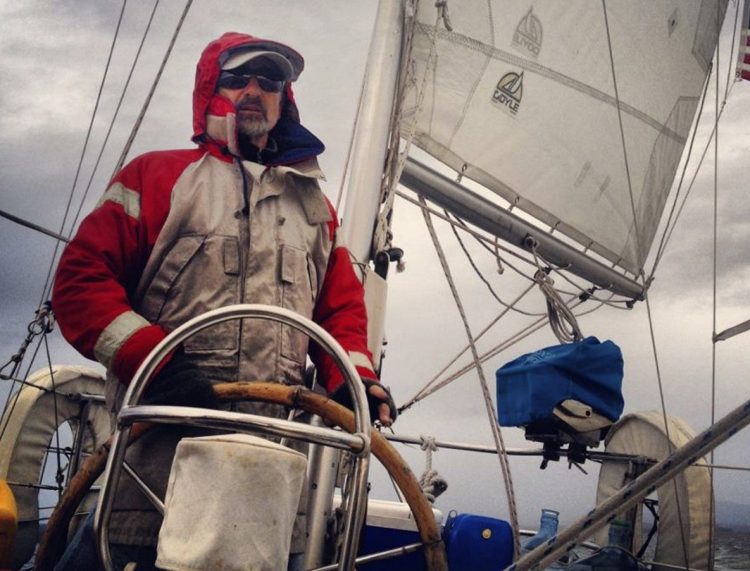 Capt. Richard Smith stands at the helm of his sailboat, the Cimarron. Smith, who charters in Camden and the U.S. Virgin Islands, was charged in connection with the death of a crew member aboard the boat in 2015.
