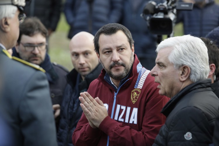 Italian Interior Minister and Deputy-Premier Matteo Salvini, flanked by Ancona's head of police Oreste Capocasa, leaves disco Lanterna Azzurra after a site inspection Saturday. Five young teens and one adult died in a 1 a.m. stampede at an overcrowded rap concert there Saturday.  Associated Press/Andrew Medichini