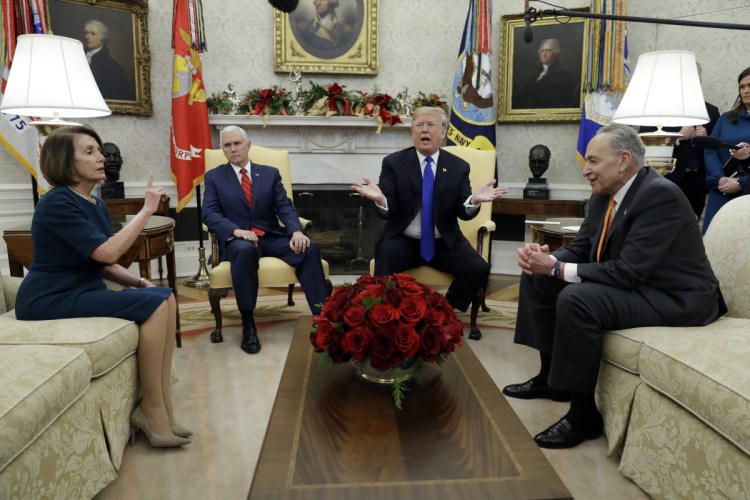 President Trump and Vice President Mike Pence meet with Senate Minority Leader Chuck Schumer, D-N.Y., and House Minority Leader Nancy Pelosi, D-Calif., in the Oval Office of the White House on Tuesday in Washington. The meeting quickly became testy.