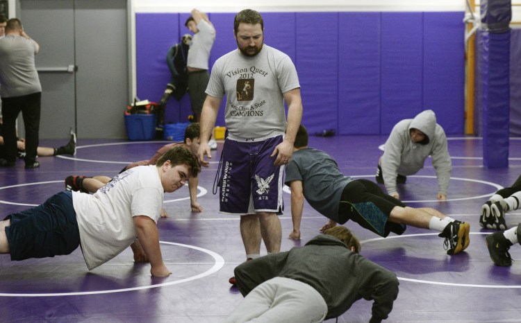 Marshwood Coach Pat Howard watches his team warm up for practice recently. Howard, who was a star wrestler at Marshwood in the early 2000s, takes over for longtime coach Matt Rix.