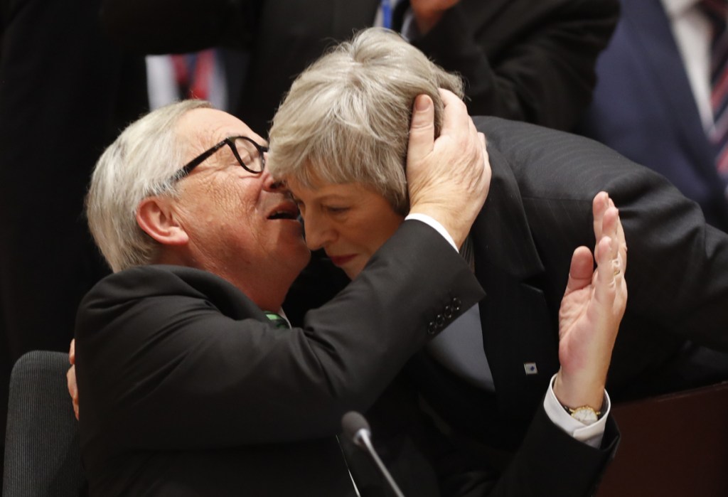 European Commission President Jean-Claude Juncker greets British Prime Minister Theresa May at the EU summit Thursday in Brussels where leaders offered their sympathy over her Brexit predicament.