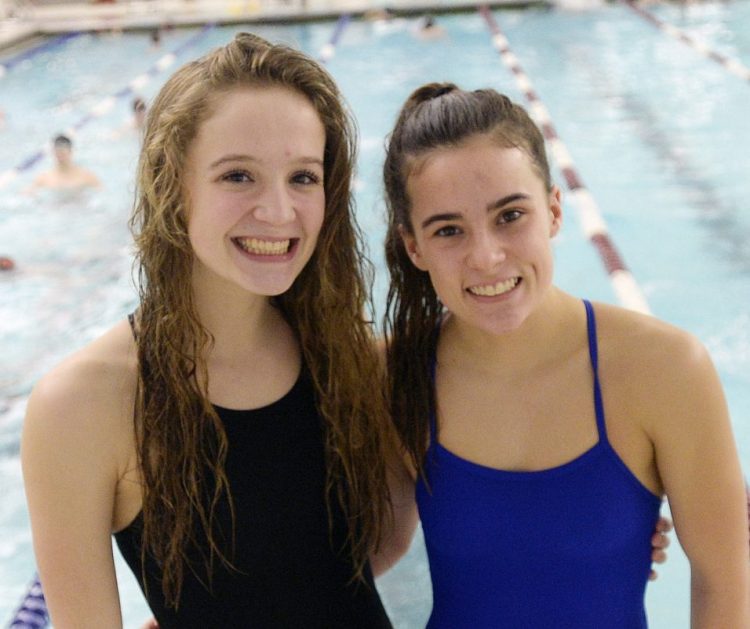 Olivia Harper, left, is slightly older and 3 inches taller than her twin sister, Haily. The two own or share seven Morse High swimming records.