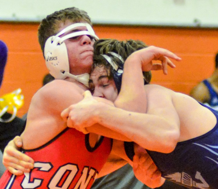 Casey Mills, left, of Cony battles with Westbrook's Henri Kuntz in a 170-pound match Saturday at the Gardiner Tiger tournament. Cony edged Kennebunk for the team title.