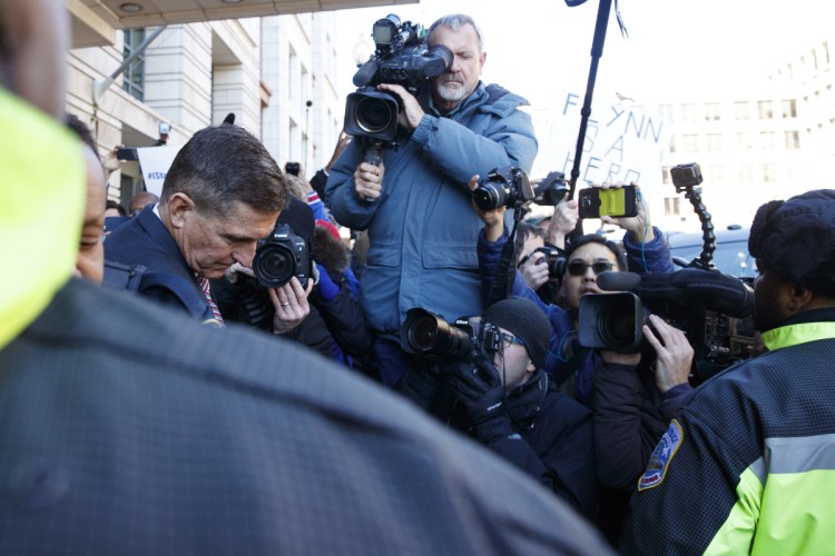 President Trump's former national security adviser Michael Flynn leaves federal court in Washington on Tuesday after his sentencing was postponed.