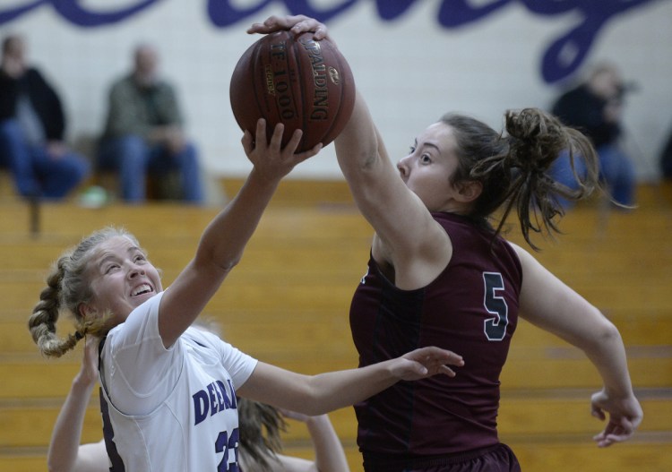 Gorham's Mackenzie Holmes, right, had 33 points, 28 rebounds and five blocks, this one on Delaney Haines.