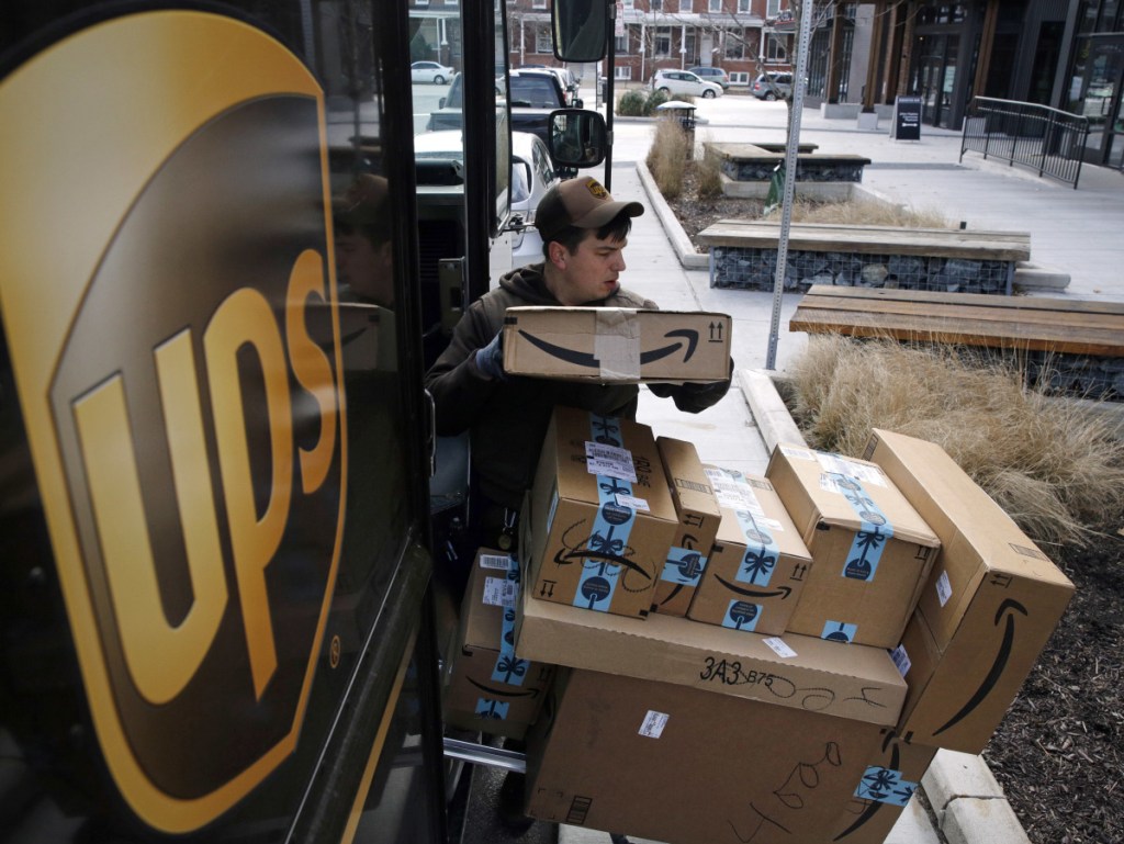 A UPS driver prepares to deliver packages Wednesday in Baltimore. The company says its busiest return day has crept up earlier in the past six years.