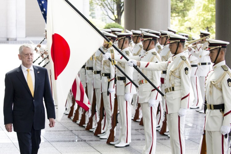 Defense Secretary James Mattis observes an honor guard in Tokyo on June 29.