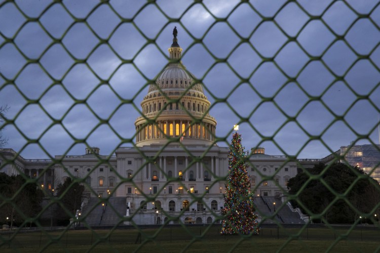 The Capitol is seen on the first morning of a partial government shutdown, as Democratic and Republican lawmakers are at a standoff with President Trump on spending for his border wall. Government operations will be disrupted during the shutdown and hundreds of thousands of federal workers will be furloughed or forced to work without pay just days before Christmas.