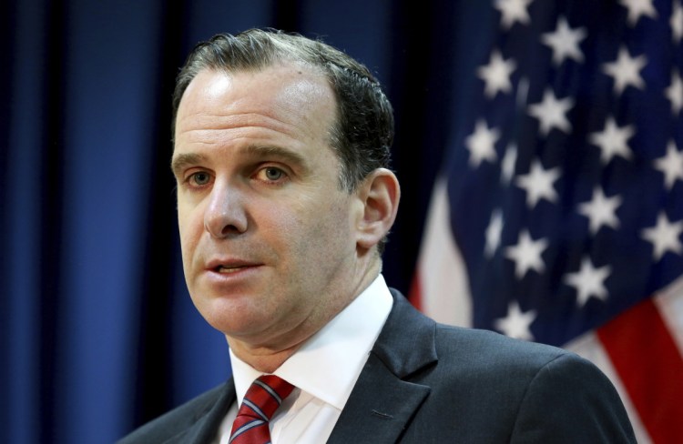 Brett McGurk, the U.S. envoy for the global coalition against IS, speaks during a news conference at the U.S. Embassy in Baghdad.  McGurk has resigned in protest of President Trump's abrupt decision to withdraw U.S. troops from Syria, joining Defense Secretary Jim Mattis in an administration exodus of experienced national security officials.
