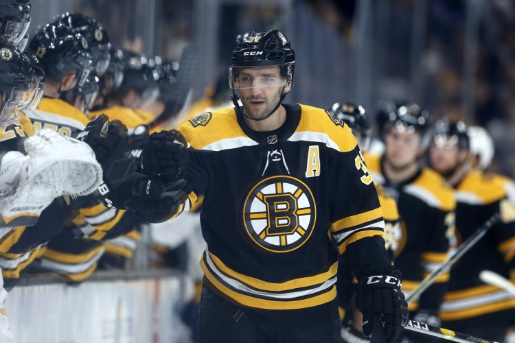 Boston Patrice Bergeron, who missed 16 games with a rib injury, scored two goals Saturday in Boton's 5-2 win to reach 300 for his career.