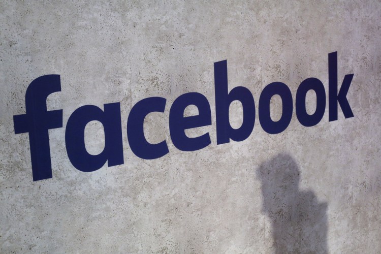 A Facebook logo is displayed at a start-up companies' gathering in Paris in 2017. We may remember 2018 as the year in which technology's dystopian potential became clear, from Facebook's role enabling the harvesting of our personal data for election interference to a seemingly unending series of revelations about the dark side of Silicon Valley's connect-everything ethos.