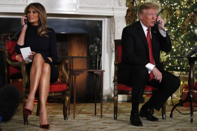 President Trump and first lady Melania Trump both speak on the phone while sharing updates to track Santa's movements from the North American Aerospace Defense Command (NORAD) Santa Tracker on Christmas Eve.