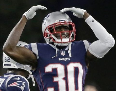 New England Patriots defensive back Jason McCourty celebrates an interception by Duron Harmon during the second half against the Minnesota Vikings on Dec. 2.